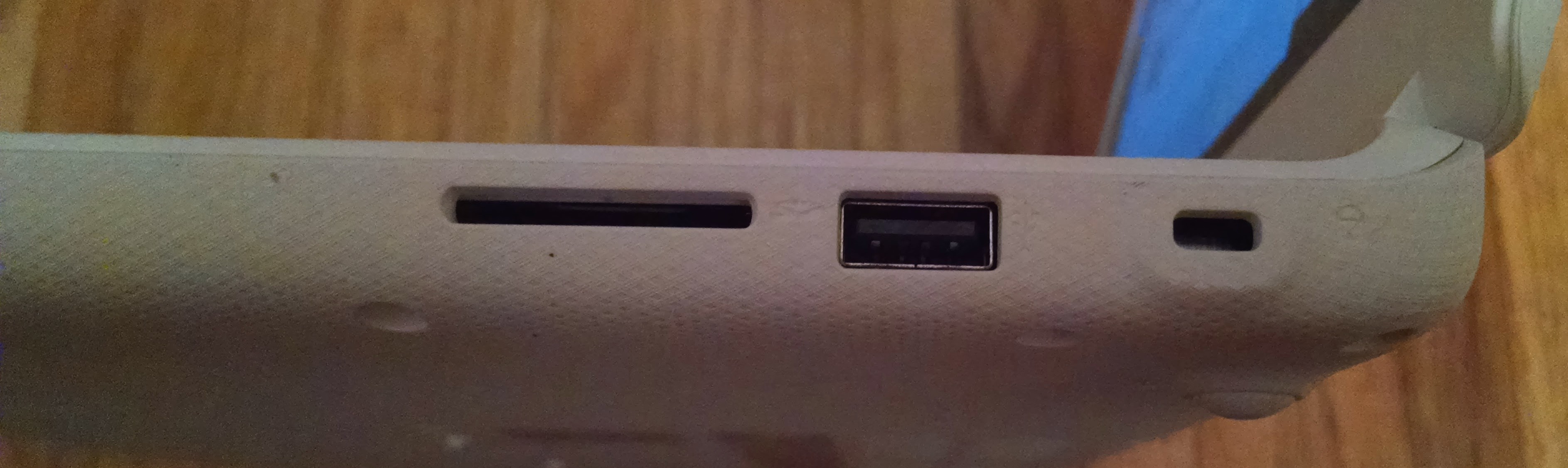 Right-side ports: SD Card, USB-2